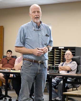 Fred Clark speaks to meeting participants