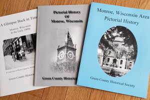 A Glimpse Back In Time, The Pictorial History of Monroe, and the Monroe, Wisconsin Pictorial History are three books published by the Green County Historical Society and picture many of the area’s historical scenes. The photo on the cover of the blue book