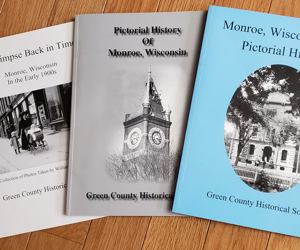 A Glimpse Back In Time, The Pictorial History of Monroe, and the Monroe, Wisconsin Pictorial History are three books published by the Green County Historical Society and picture many of the area’s historical scenes. The photo on the cover of the blue book