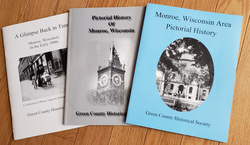 A Glimpse Back In Time, The Pictorial History of Monroe, and the Monroe, Wisconsin Pictorial History are three books published by the Green County Historical Society and picture many of the area’s historical scenes. The photo on the cover of the blue book