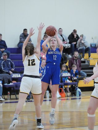 Monticello’s Ellie Gustafson puts up a contested shot in the second half of her team’s 41-22 victory at Juda Dec. 9. Gustafson led all scorers with 15 points.