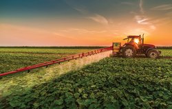 farm tractor sunset stock