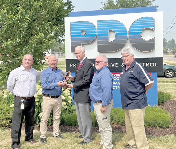 Johnson Accepts Merit Eagle Award