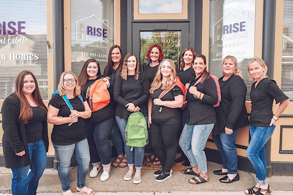 DC Rise Donates Backpacks - Monroe Times