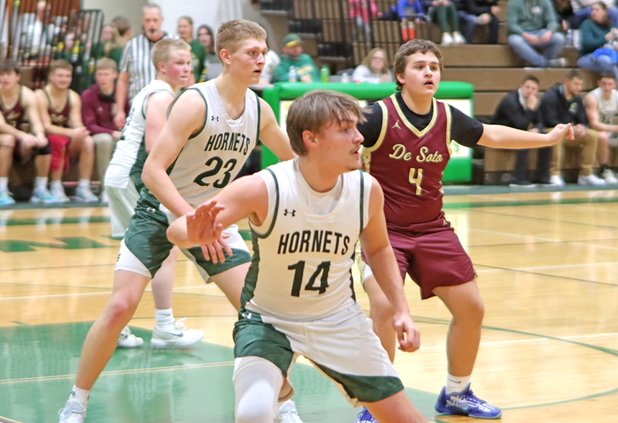 Dakota Cox defends against De Soto 2026