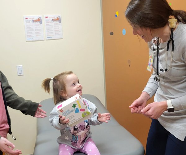 SSM health pediatricians writing a prescription for play