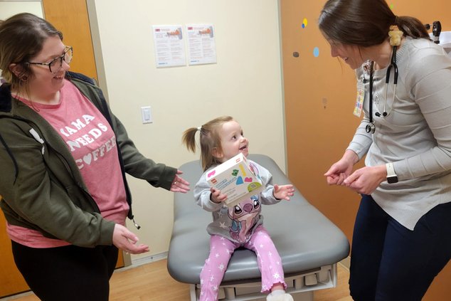 SSM health pediatricians writing a prescription for play