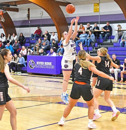 Erin Adrian shoots against Belmont