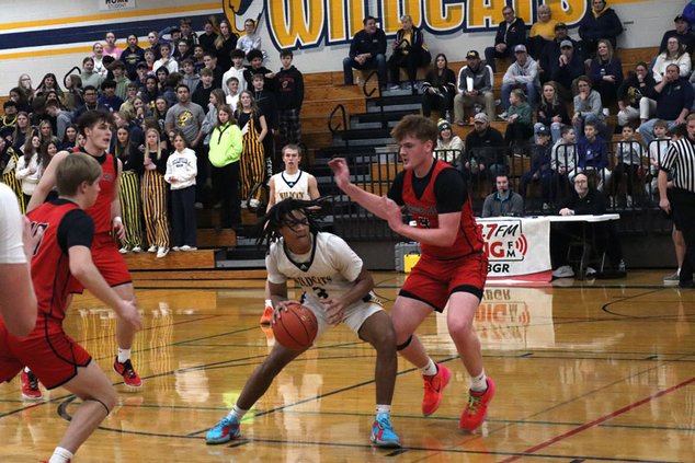 Wildcats fend off Cardinals