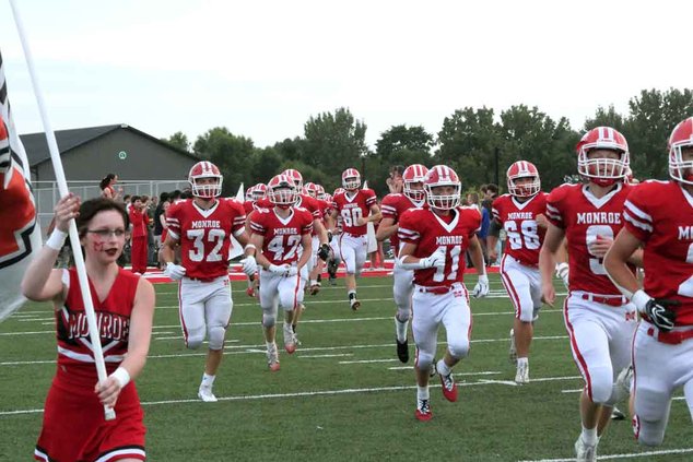 Monroe’s football team enters the field for the first varsity game 2026