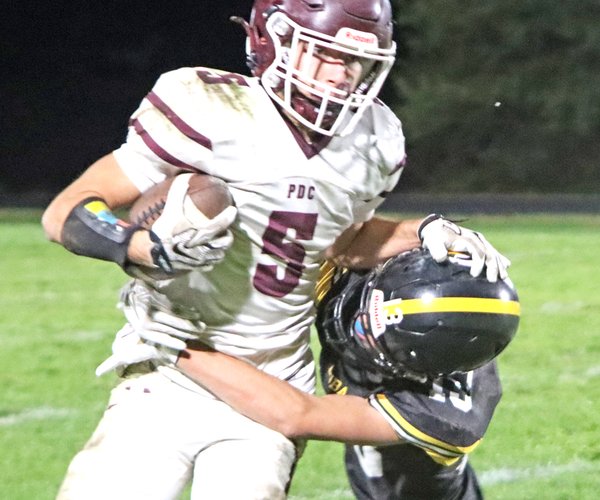 Brock Radloff fights off CC tackler 1