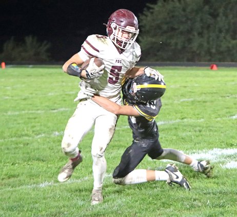 Brock Radloff fights off CC tackler 1